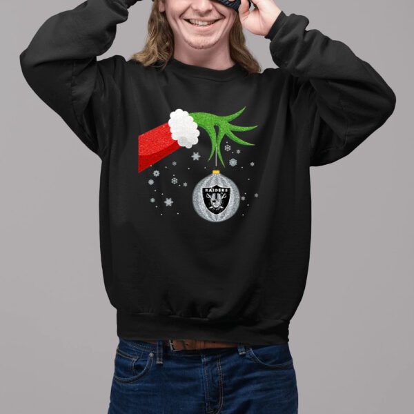 This Grinch Christmas Ornament Oakland Raiders Sweat Shirt is the perfect way to show your team spirit this holiday season! This stylish and comfortable sweat shirt is made from a soft cotton blend fabric, making it perfect for those chilly winter days. The Grinch design is printed on the front of the shirt in vibrant colors, making it a great way to show your team pride. The Oakland Raiders logo is also featured on the back of the shirt, adding an extra touch of team spirit. This sweat shirt is perfect for any Raiders fan, as it is both stylish and comfortable. The fabric is lightweight and breathable, making it ideal for those cold winter days. The Grinch design is sure to bring a smile to your face, while the Raiders logo will show your team pride. This sweat shirt is also great for gifting, as it is sure to be a hit with any Raiders fan. This Grinch Christmas Ornament Oakland Raiders Sweat Shirt is the perfect way to show your team spirit this holiday season. With its stylish design, comfortable fabric, and vibrant colors, this sweat shirt is sure to be a hit with any Raiders fan. Show your team pride and stay warm this winter with this unique and stylish sweat shirt.